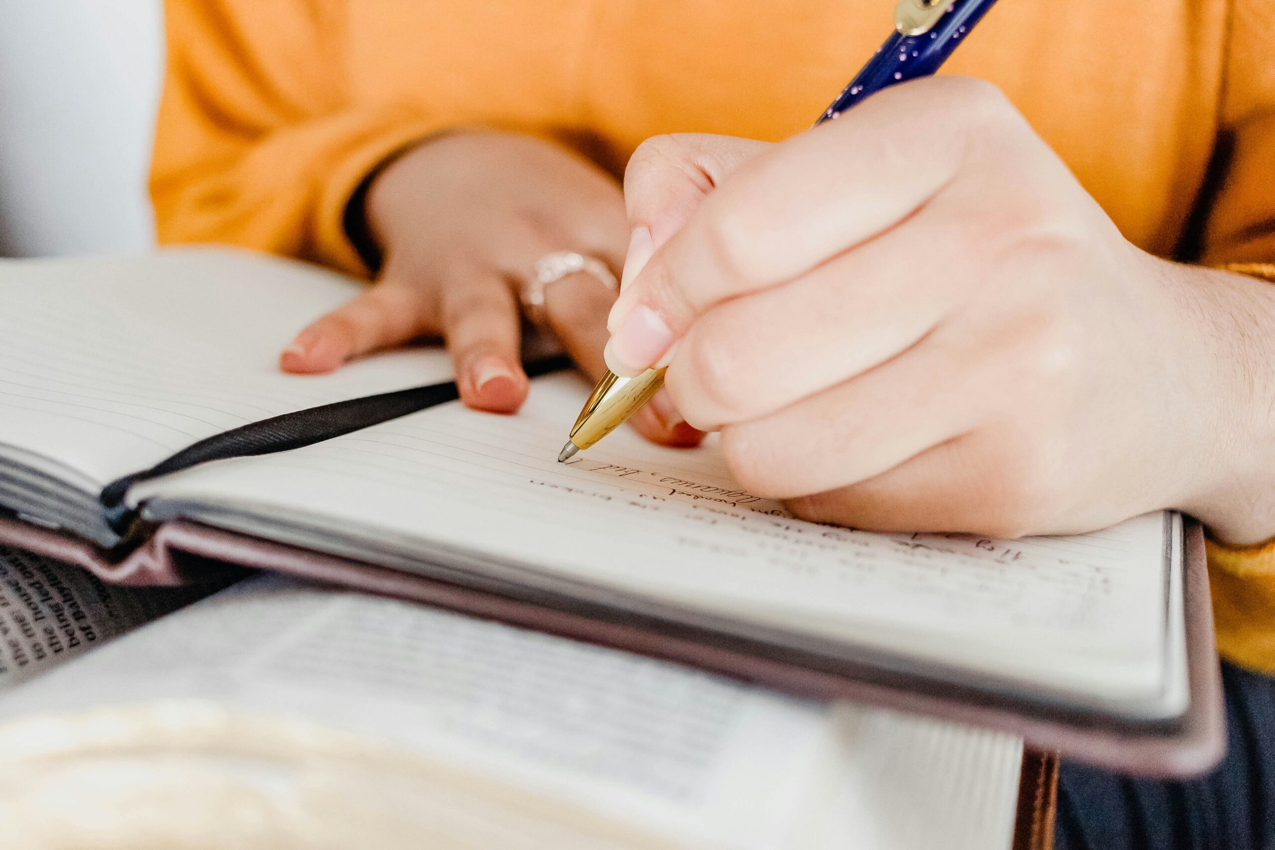 Student writing a case study on a paper