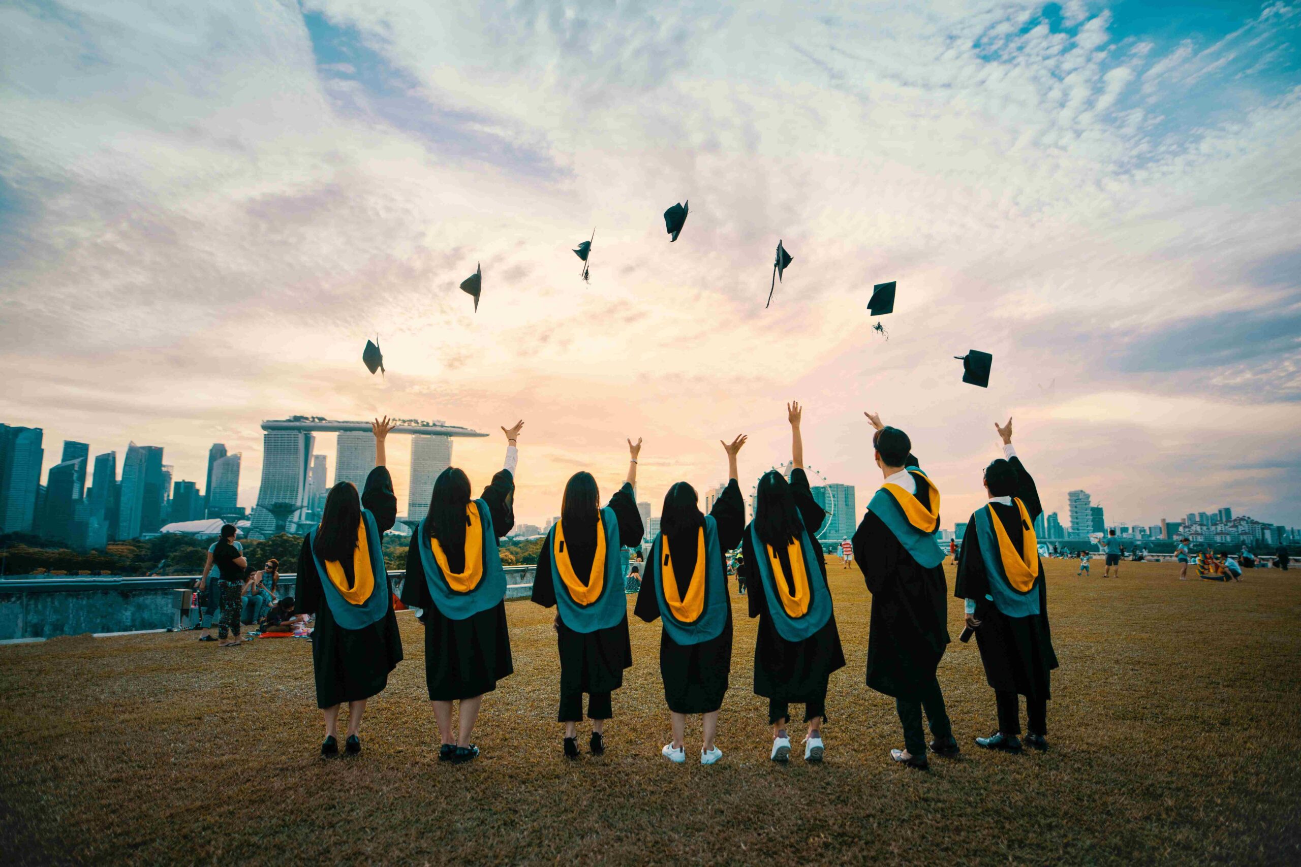 Graduates throwing caps in the air