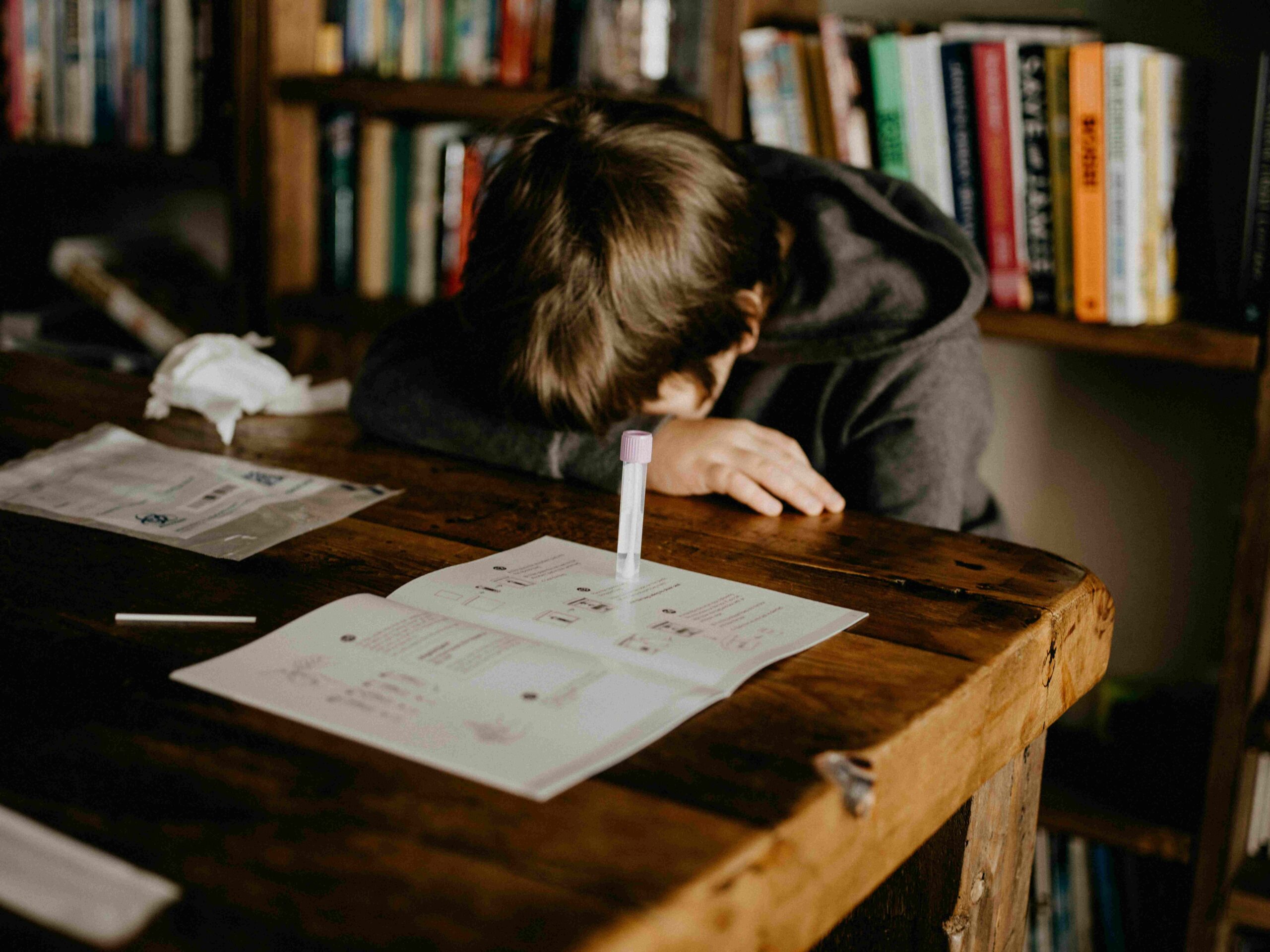 Stressed student lying on a desk