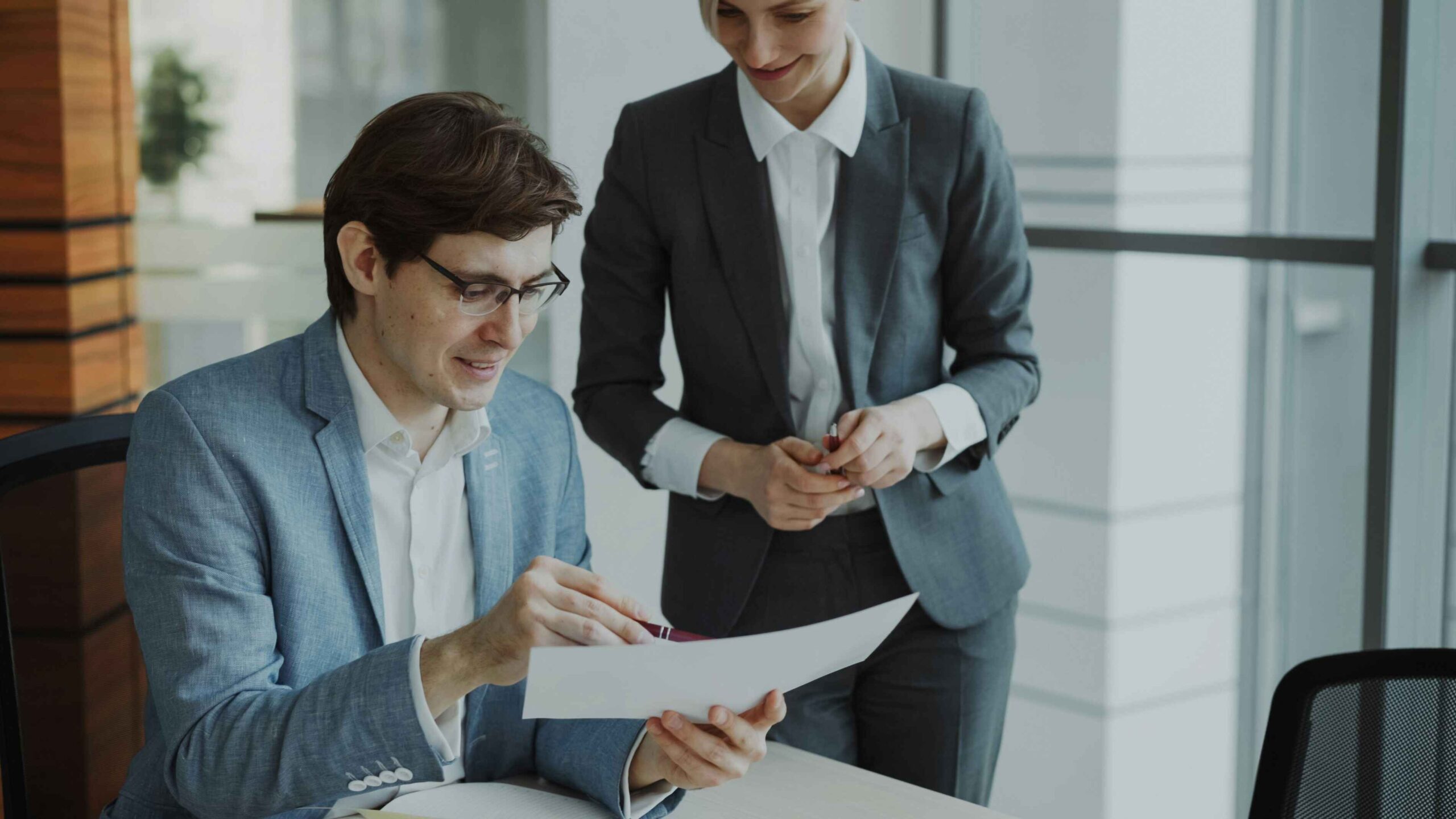 A proofreader proofreading a group business report.